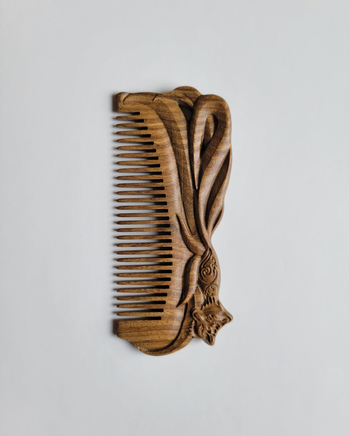 Fox hand carved sandalwood comb front view — artisan crafted, green sandalwood