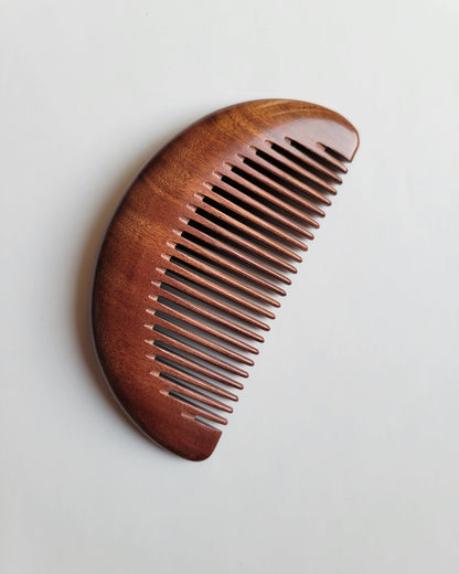 Fine-tooth wood comb with 0.15 cm spacing for gentle detangling of fine hair and beards