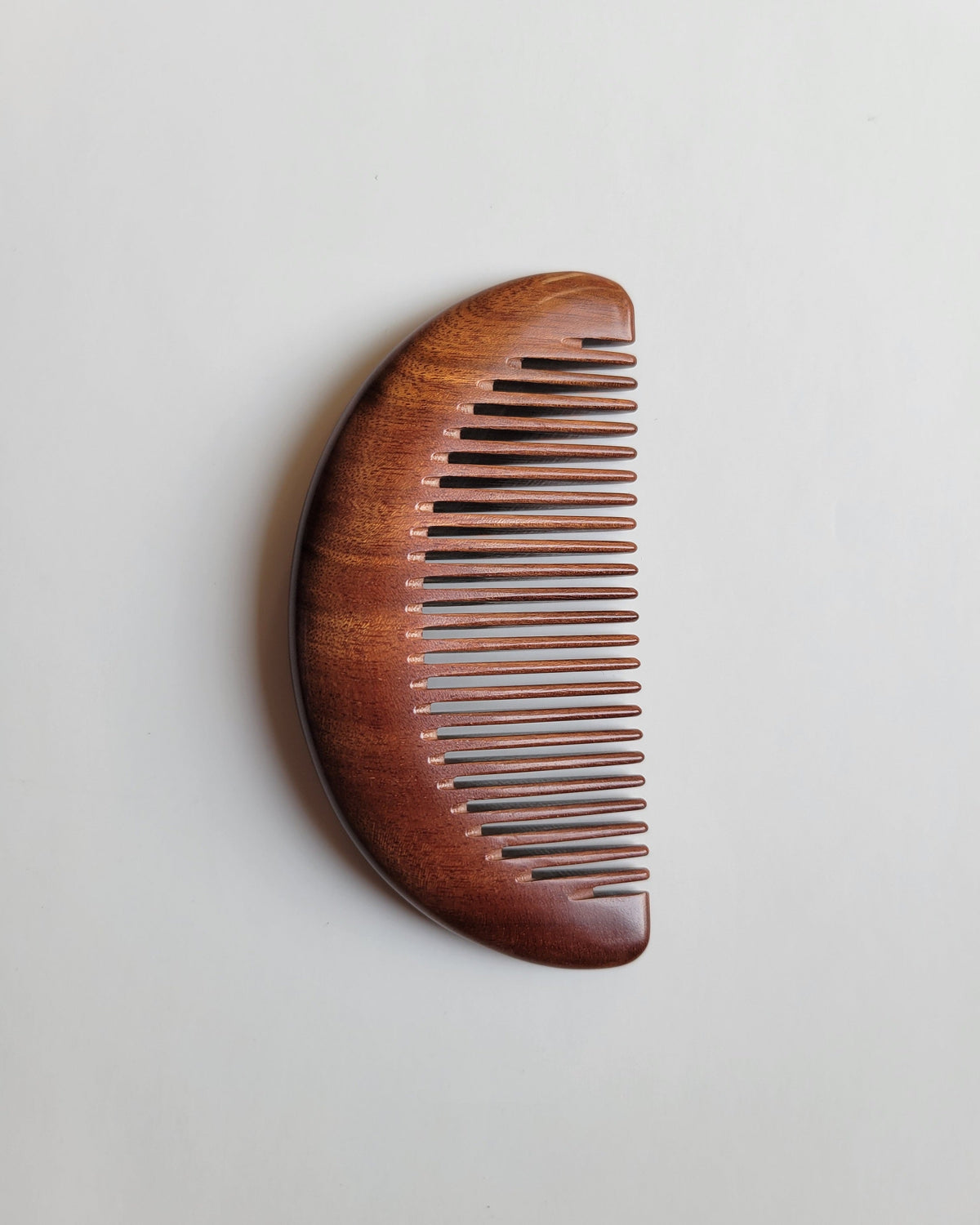 Ergonomic anti-static wooden comb with an easy grip for comfortable daily grooming and natural oil distribution