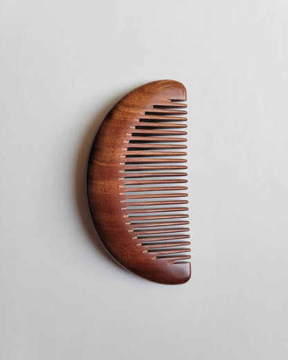 Ergonomic anti-static wooden comb with an easy grip for comfortable daily grooming and natural oil distribution