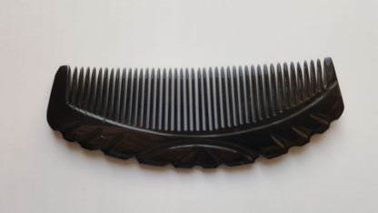 Handcrafted buffalo horn fine tooth comb, side profile showing horn thickness and curve — Arakicrafts