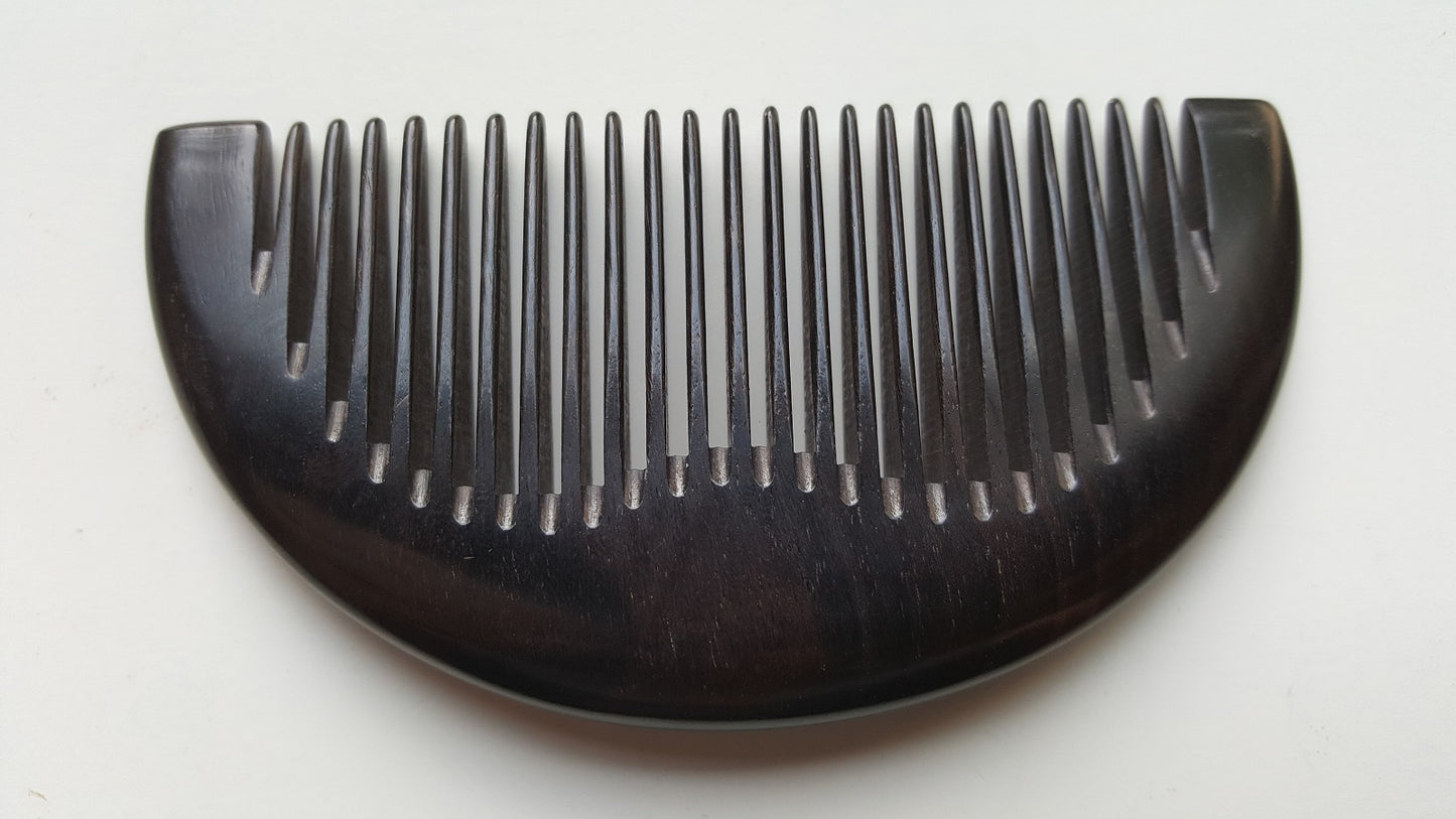 Jet-black African Ebony half-moon pocket comb, flat lay front view — Arakicrafts