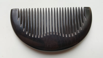 Jet-black African Ebony half-moon pocket comb, flat lay front view — Arakicrafts