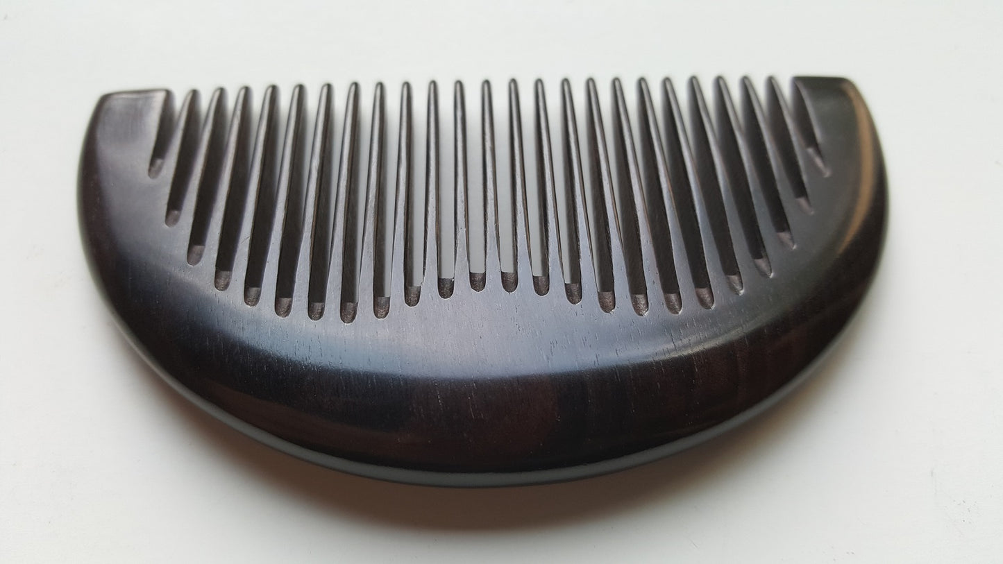 Minimalist half-moon hardwood comb for beard grooming and everyday carry, flat lay — Arakicrafts