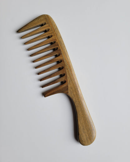 Araki Detangling Wood Comb flat view — hand-inlaid green sandalwood, wide tooth construction