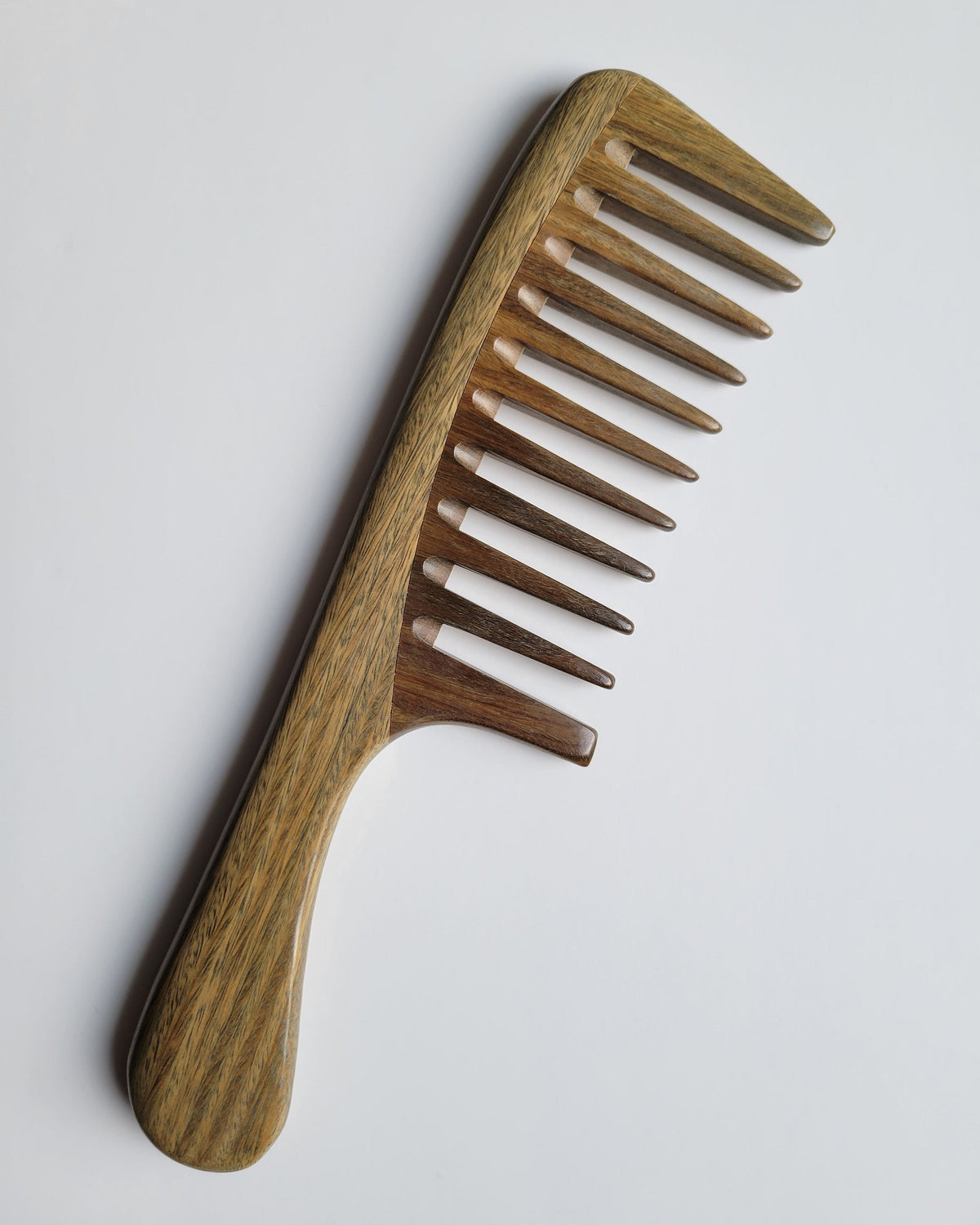 Araki green sandalwood wide tooth comb — designed to detangle coily and curly hair gently