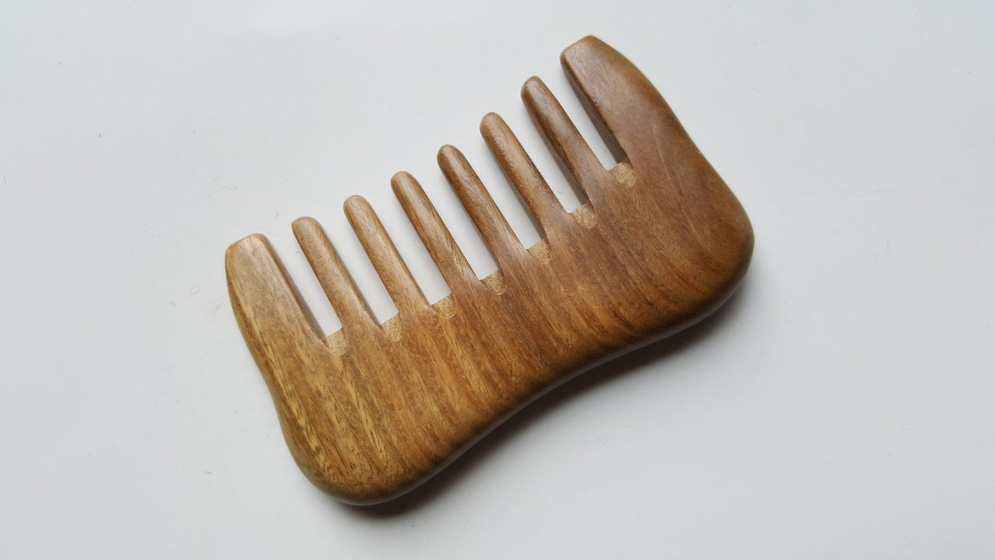 A extra wide teeth sandalwood comb designed for curly and thick hair. Comes with carrying bag and gift for her