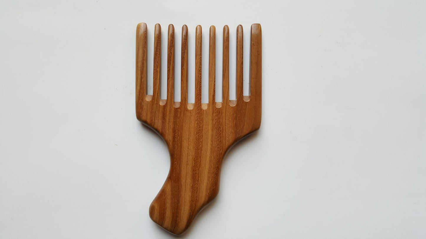A wooden pick comb with a unique handle design. The comb has nine teeth and is made of light brown sandalwood.  Gift for him who grows long hair!