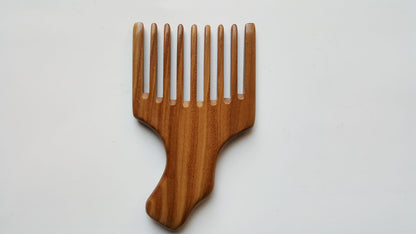 A wooden pick comb with a unique handle design. The comb has nine teeth and is made of light brown sandalwood.  Gift for him who grows long hair!
