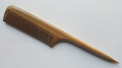 hand inlayed sandalwood rat tail comb with a long pointed handle.