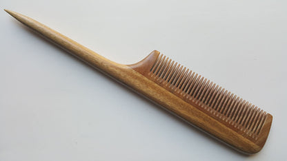 Hand Inlayed fine teeth rat tail comb for precision sectioning. It is made of green sandalwood.