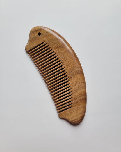 Fish shaped sandalwood comb with comfortable ergonomic grip, anti-static hardwood, distributes natural hair oils for healthy shine