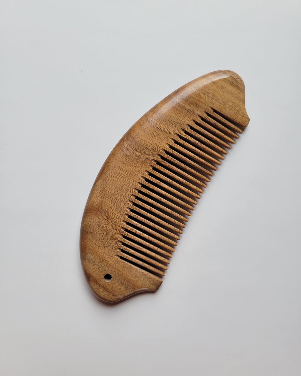 Aromatic green sandalwood fish comb for women and men, symbolic fish form, pocket-sized travel hair comb and self-care gift