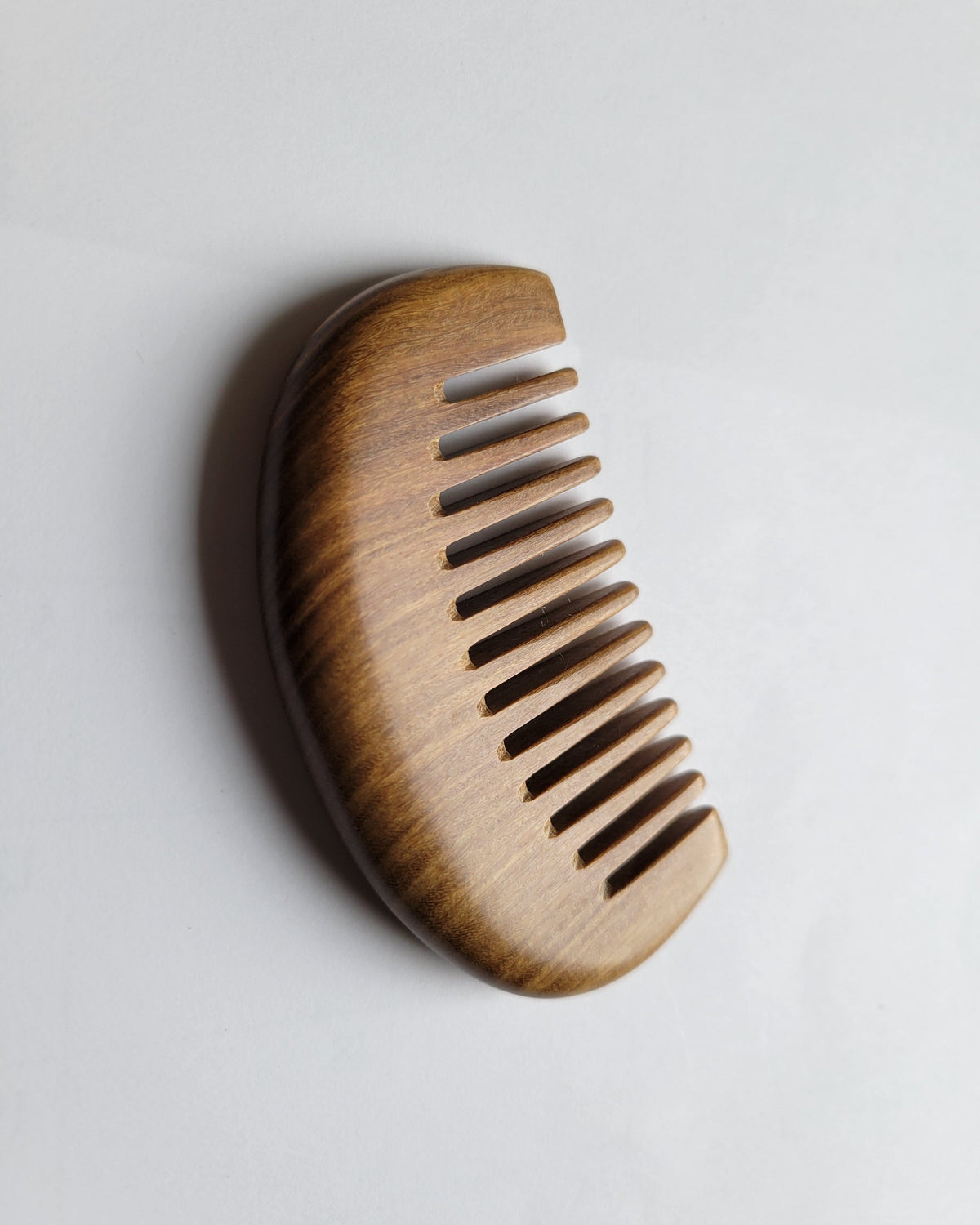 Green sandalwood mini wide tooth comb — crescent shape, easy grip, anti-static pocket comb for men and women