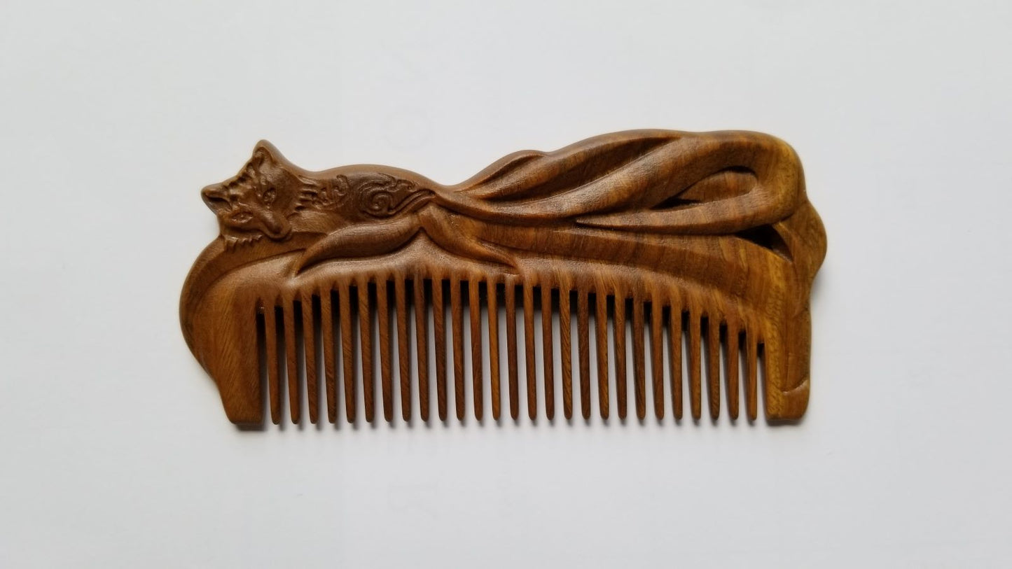 A beautiful hand carved Fox Design Vintage Style sandalwood Comb — front view