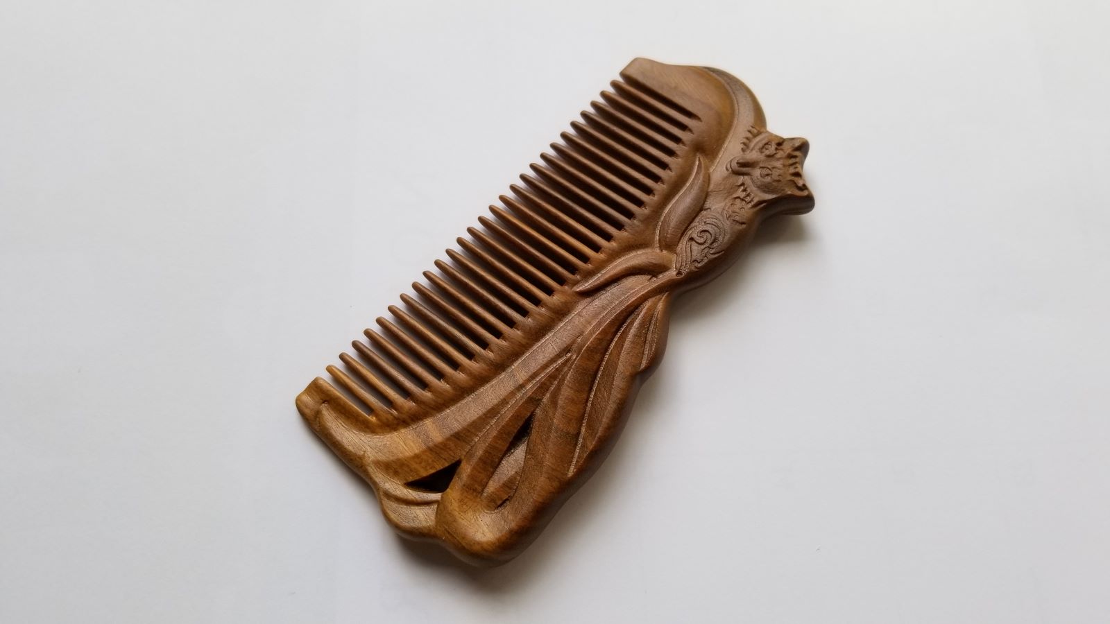 A beautiful hand carved Fox Design Sandalwood Comb on both sides. Fine Teeth, Vintage style gift for him
