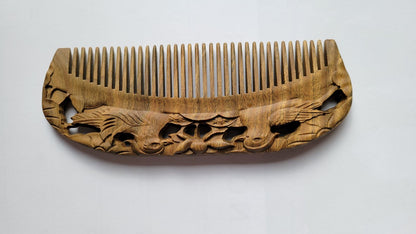 Mandarin Duck Hand Carved Sandalwood Comb flat lay — overhead view showing full comb length and mandarin duck carving on both sides