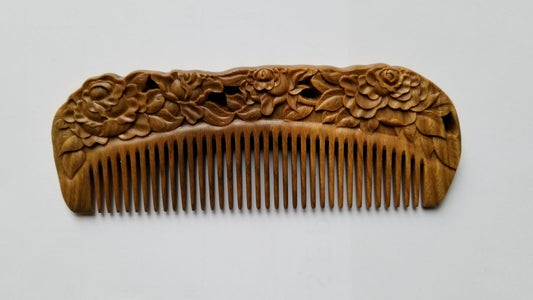 Rose Hand Carved Sandalwood Comb flat lay — front view showing hand-carved blooming rose pattern and fine teeth on green sandalwood