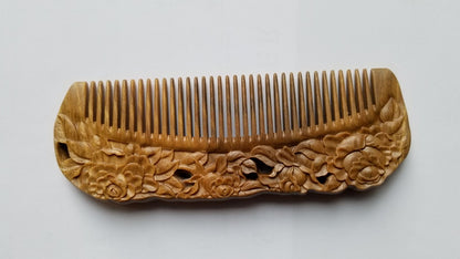 Rose Hand Carved Sandalwood Comb flat lay — overhead view showing full comb length and rose carving on both sides