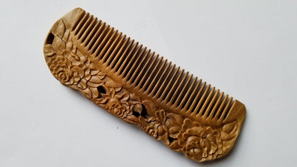 Rose Hand Carved Sandalwood Comb flat lay — angled view emphasizing green sandalwood color and hand-carved rose motif