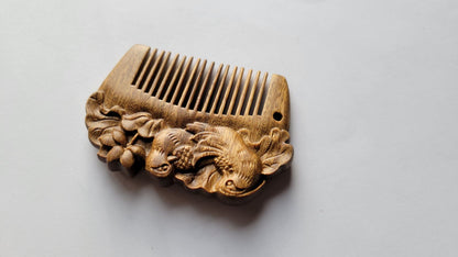 Mandarin duck hand carved comb angled right, smooth curved spine and fine tooth array