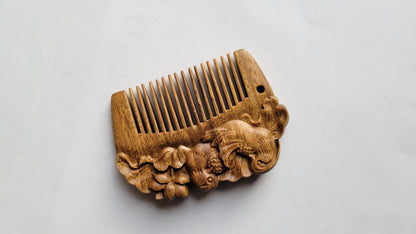 Close-up of fine teeth on mandarin duck wood comb — rounded, hand-polished teeth detail