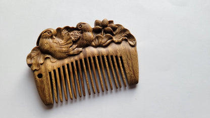 Mandarin duck hand carved green sandalwood comb flat lay on neutral surface — Arakicrafts
