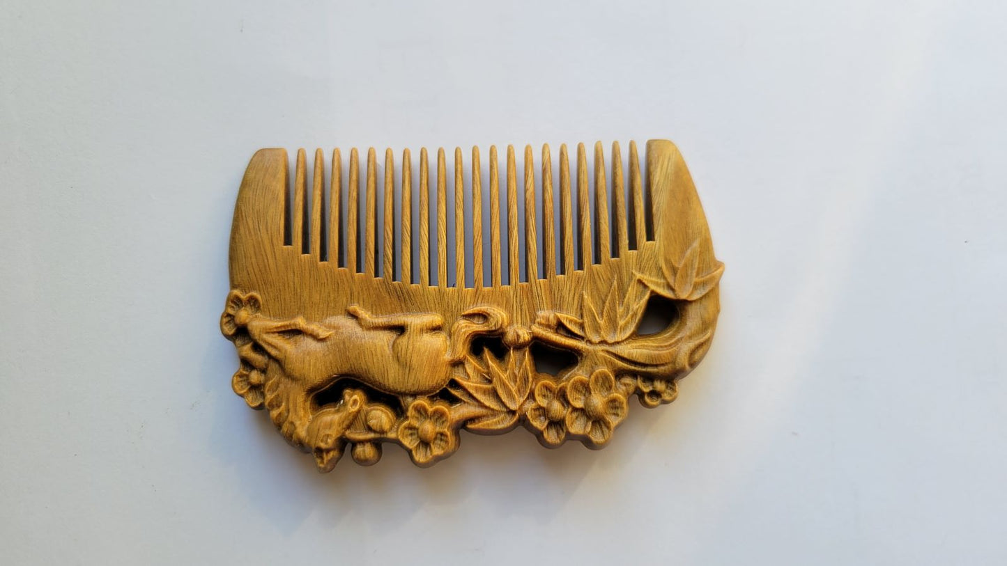 Horse bamboo plum motif hand carved sandalwood comb — underside view showing fine teeth detail