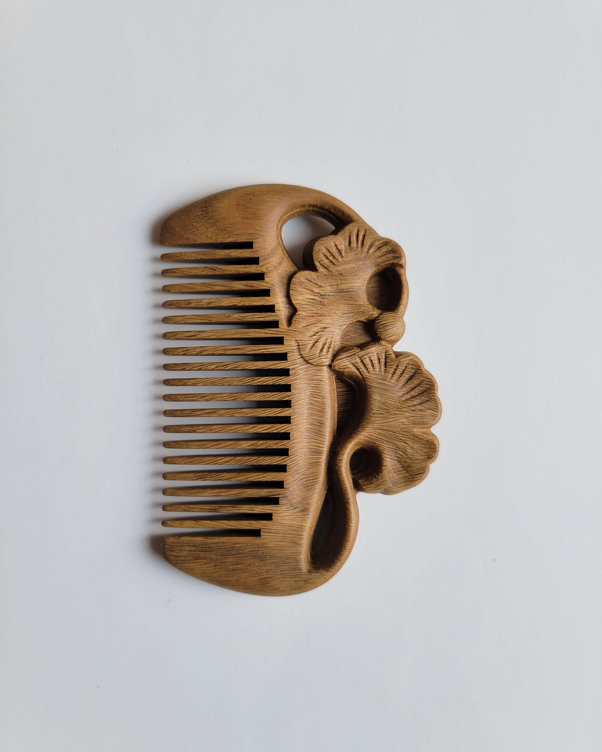 Green Sandalwood pocket comb overhead view — ginkgo leaf motif, 0.15 cm fine teeth spacing, all hair types including beard