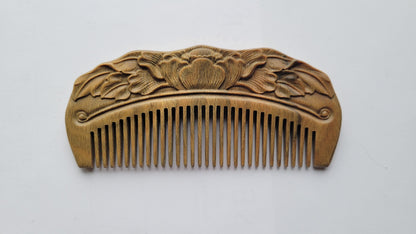 Hand carved Green Sandalwood pocket comb with blooming lotus and leaves relief carving, flat lay front view — Arakicrafts