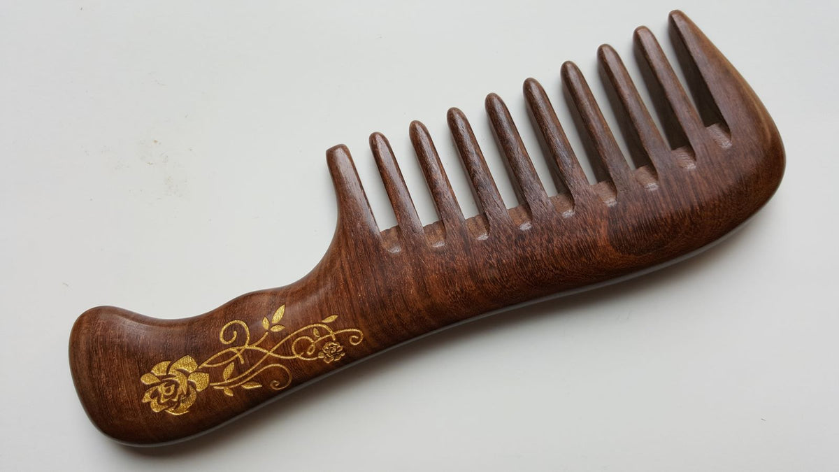 Hand-painted gold rose and vine Sucupira wood comb — extra wide teeth, front view