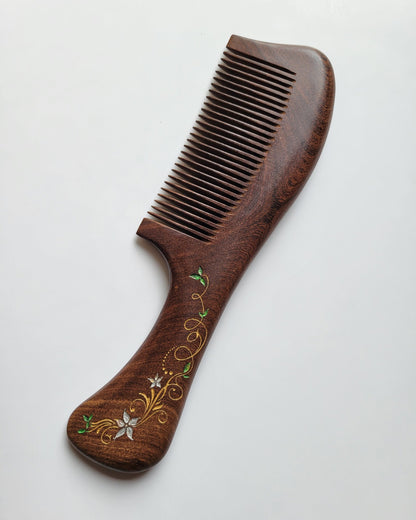 Hand-painted ivy vine wood comb — gold white and green motif on dark Sucupira wood, fine teeth