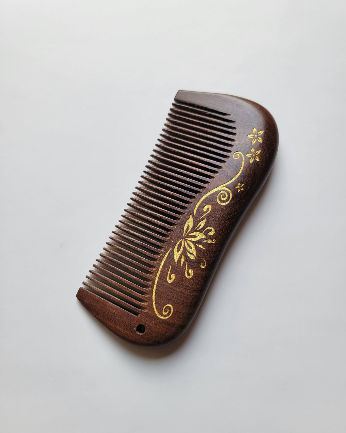 Aiko Lotus Wood Comb — nature-inspired Zen design, single-piece Sucupira hardwood, handcrafted pocket comb