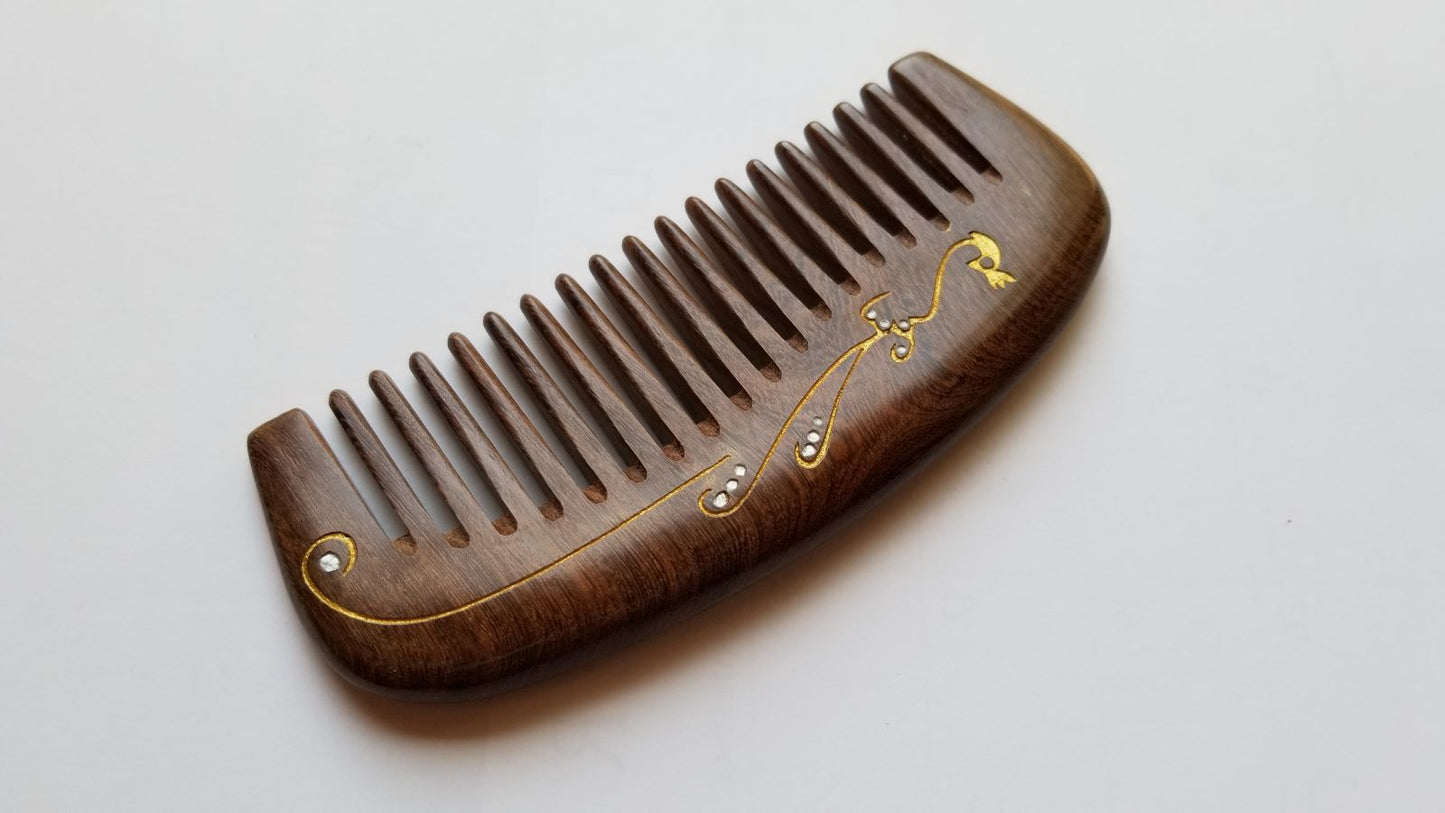 Hand painted peacock wood comb with drawstring gift bag — a meaningful gift for her — Arakicrafts. The comb's handle has a curved shape, and the overall design is elegant and functional.
