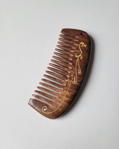 Hand painted peacock wood comb with drawstring gift bag — a meaningful gift for her — Arakicrafts. The comb's handle has a curved shape, and the overall design is elegant and functional.