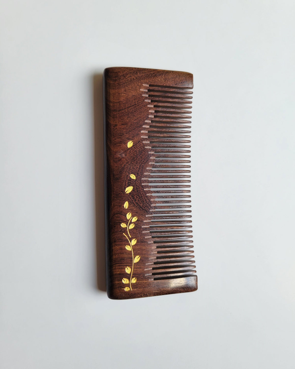 Straight Sucupira wood comb with mountain-range spine silhouette — hand-painted gold ivy vine, fine tooth