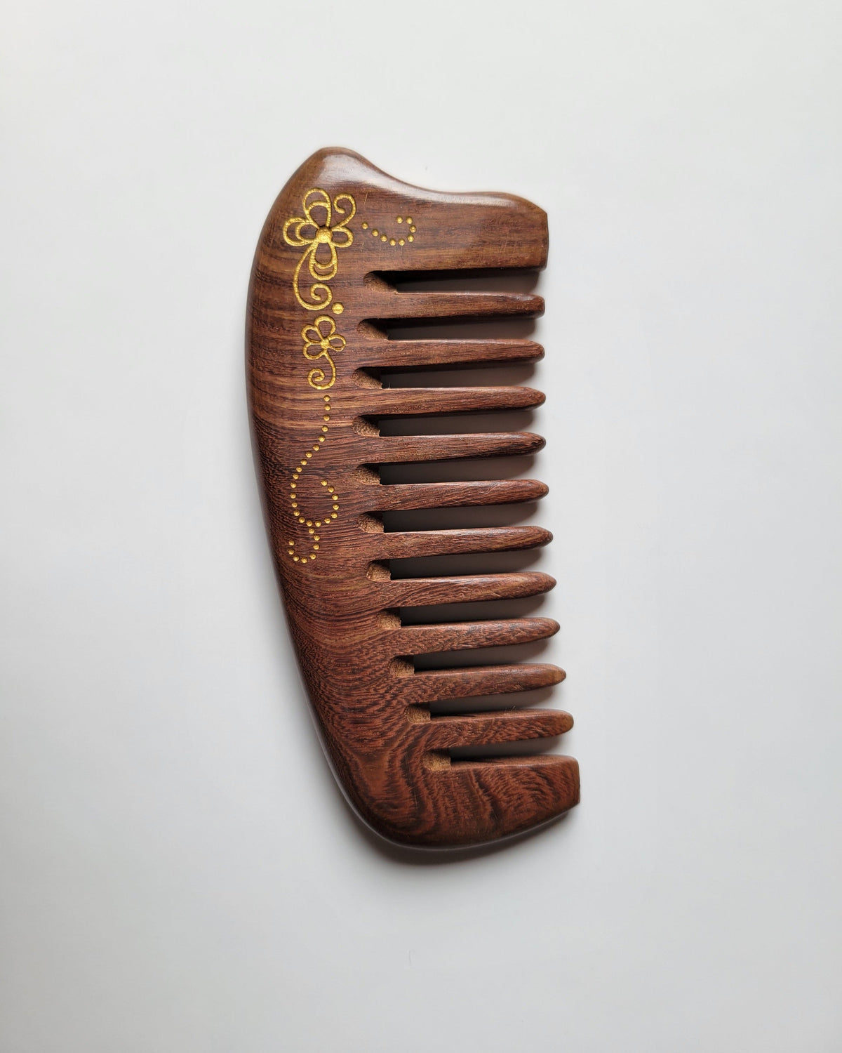 Sucupira hardwood wide tooth comb with gold painted floral vine scroll, anti-static natural wood, detangling comb for curly and wavy hair
