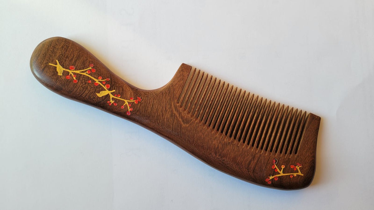 Full view hand-painted magpie and plum blossom Sucupira comb, gold birds on red branches, fine tooth comb for fine and straight hair