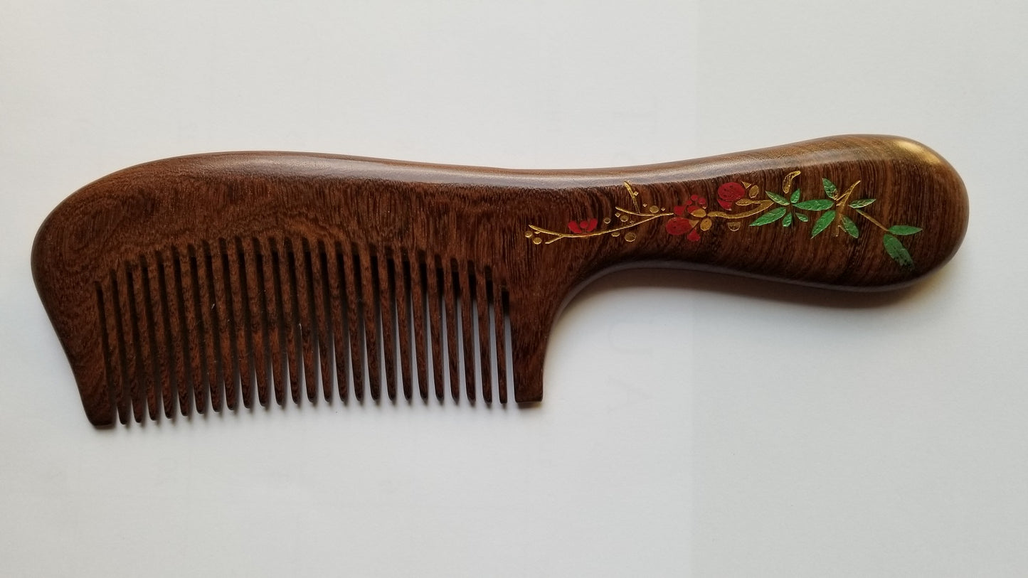 Sucupira wood comb with red plum blossom design on handle, fine teeth, curved silhouette — Arakicrafts