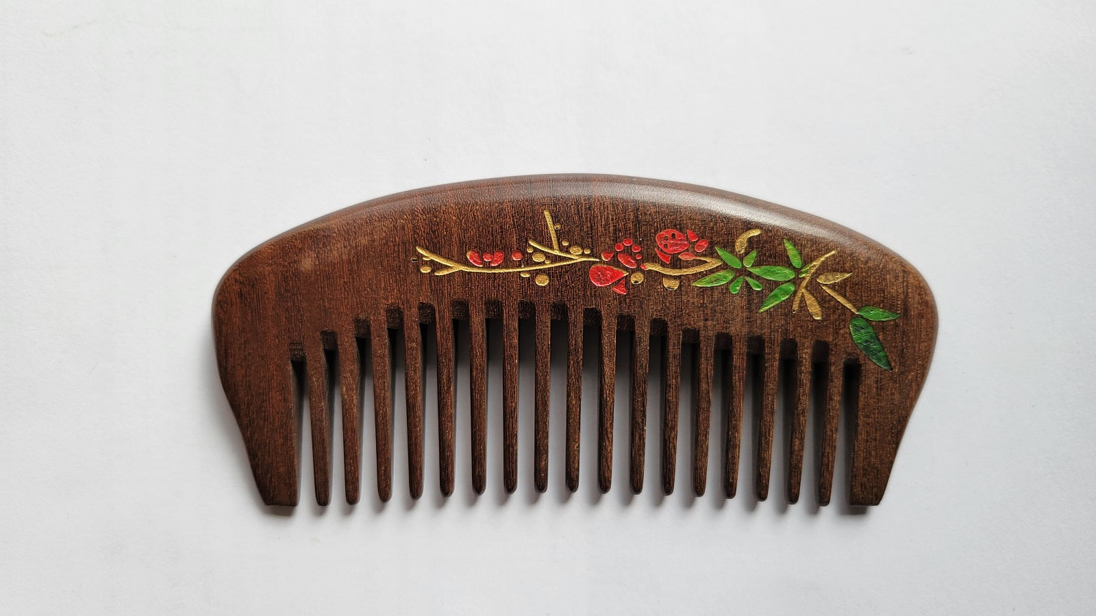 Hand painted red plum blossom pocket wood comb in dark brown Sucupira hardwood, flat lay front view — Arakicrafts
