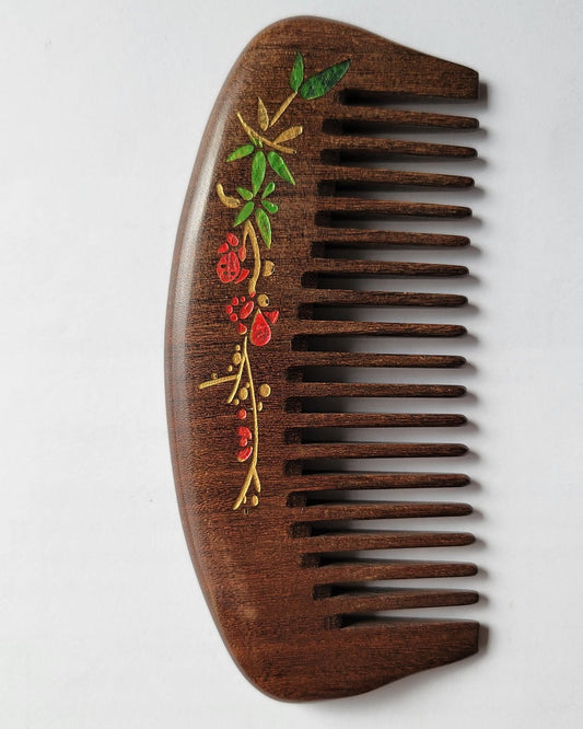 Hand painted red plum blossom pocket wood comb in dark brown Sucupira hardwood, flat lay front view — Arakicrafts