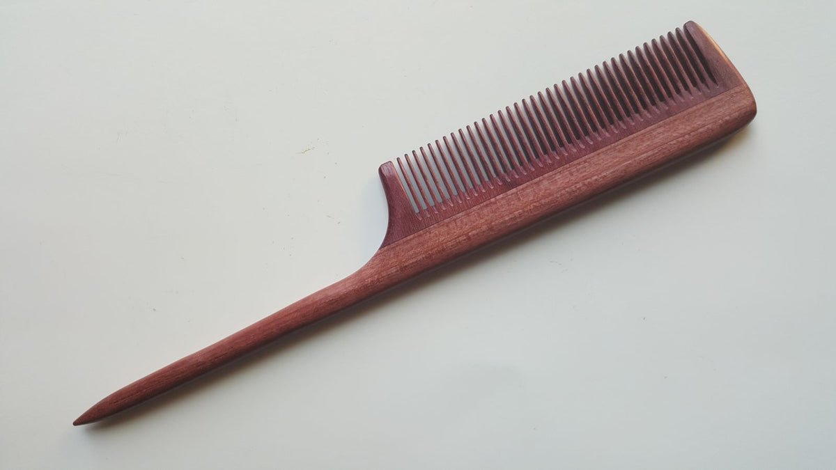 handcrafted rat tail wood comb with fine teeth, purple heart wood, beautiful pine tone wood grain. Perfect gift for her and eco-friendly