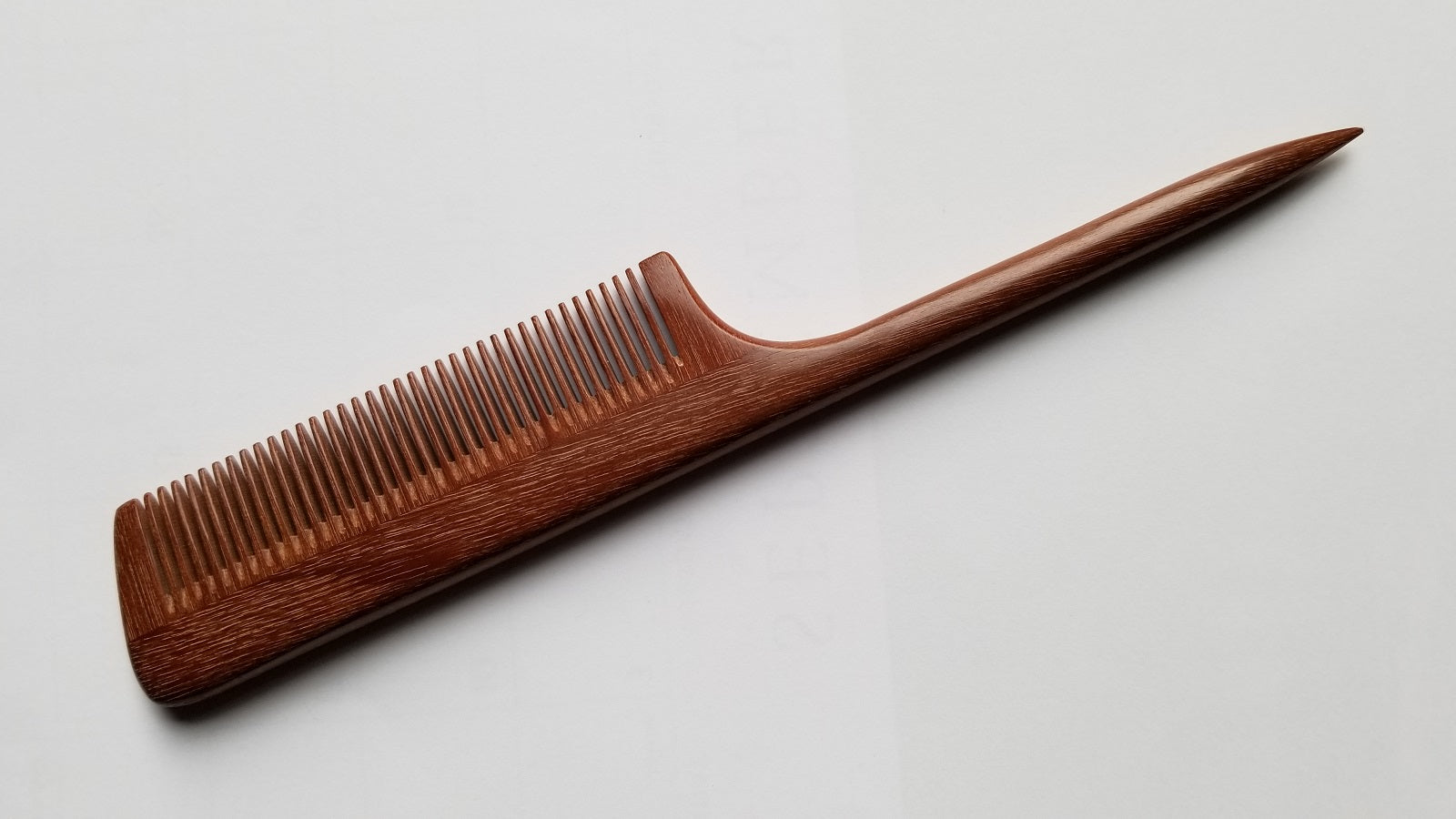 Handcrafted rat tail wood comb with fine teeth, pau rosa wood, designed for precision sectioning.  Suitable for hair styling and hair braiding. Eco luxury gift for her