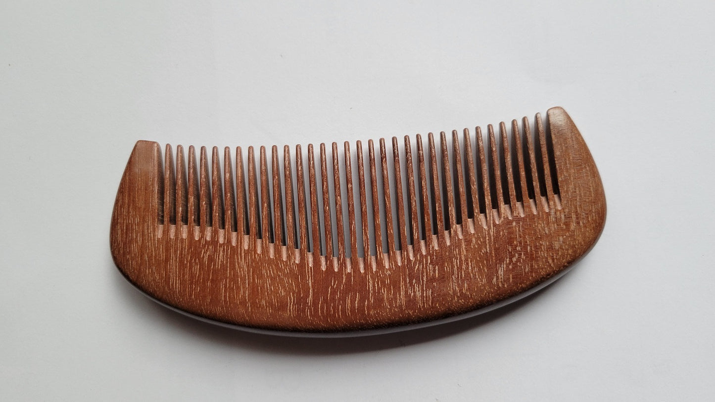 Reddish brown Pau Rosa hardwood fine tooth comb, flat lay showing smooth polished finish and wood grain — Arakicrafts
