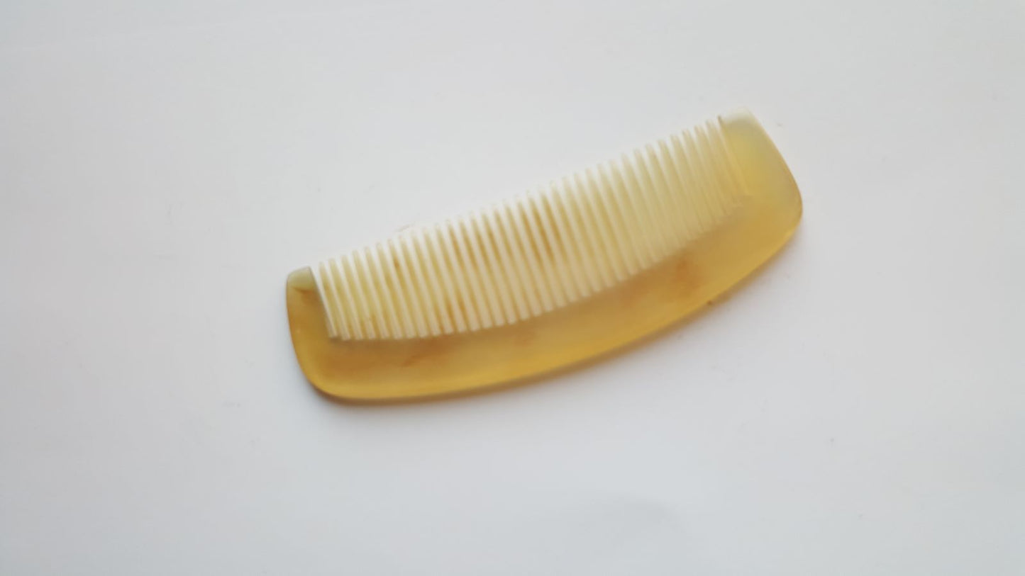 genuine sheep horn comb with a smooth, polished finish. The comb has fine teeth and is good for short hair, fine hair and men's grooming.