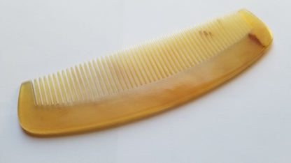 A vintage style curved comb made of sheep horn. The comb has fine teeth and a smooth, polished surface. It helps to reduce static and distributes hair oil naturally. Unique Gift for mother's Day
