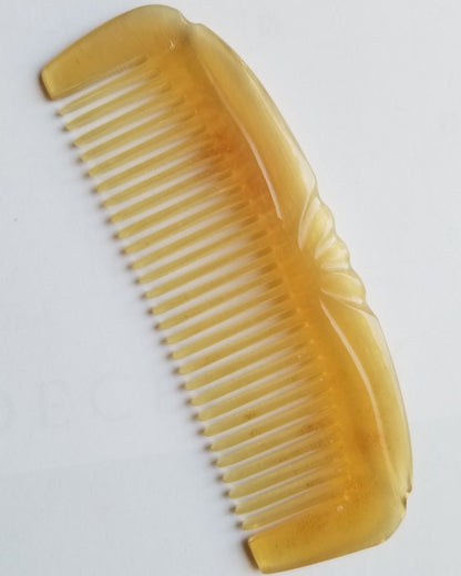 Translucent pale yellow to golden honey sheep horn comb, flat lay overhead showing natural tone variation — Arakicrafts