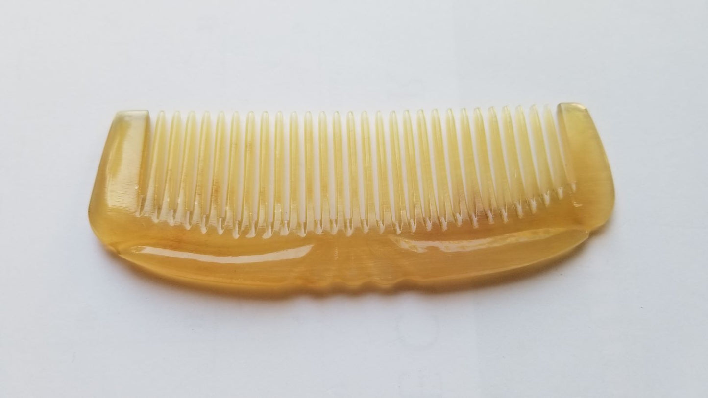 Pocket-sized Art Deco horn comb for women — translucent amber sheep horn with geometric carved detail — Arakicrafts
