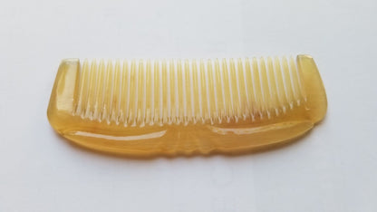 Pocket-sized Art Deco horn comb for women — translucent amber sheep horn with geometric carved detail — Arakicrafts

