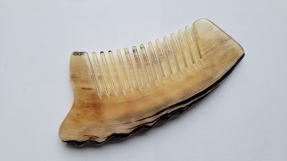 Sheep horn comb flat lay — close-up angle on wide teeth spacing